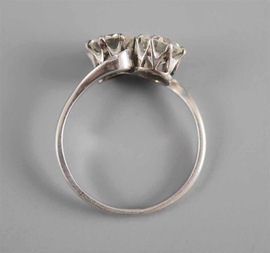 A platinum? and two stone diamond crossover ring,